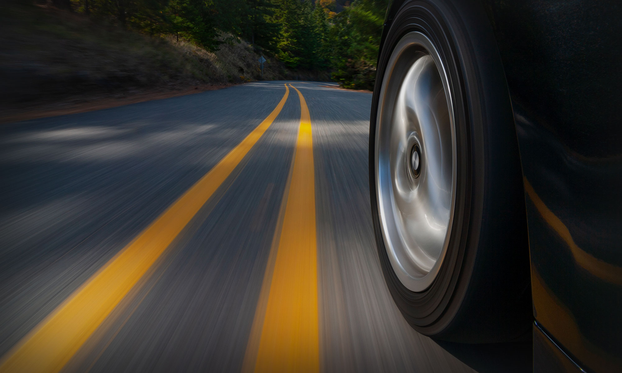ssmi_backgrounds_rubbermeetsroad car driving down the road